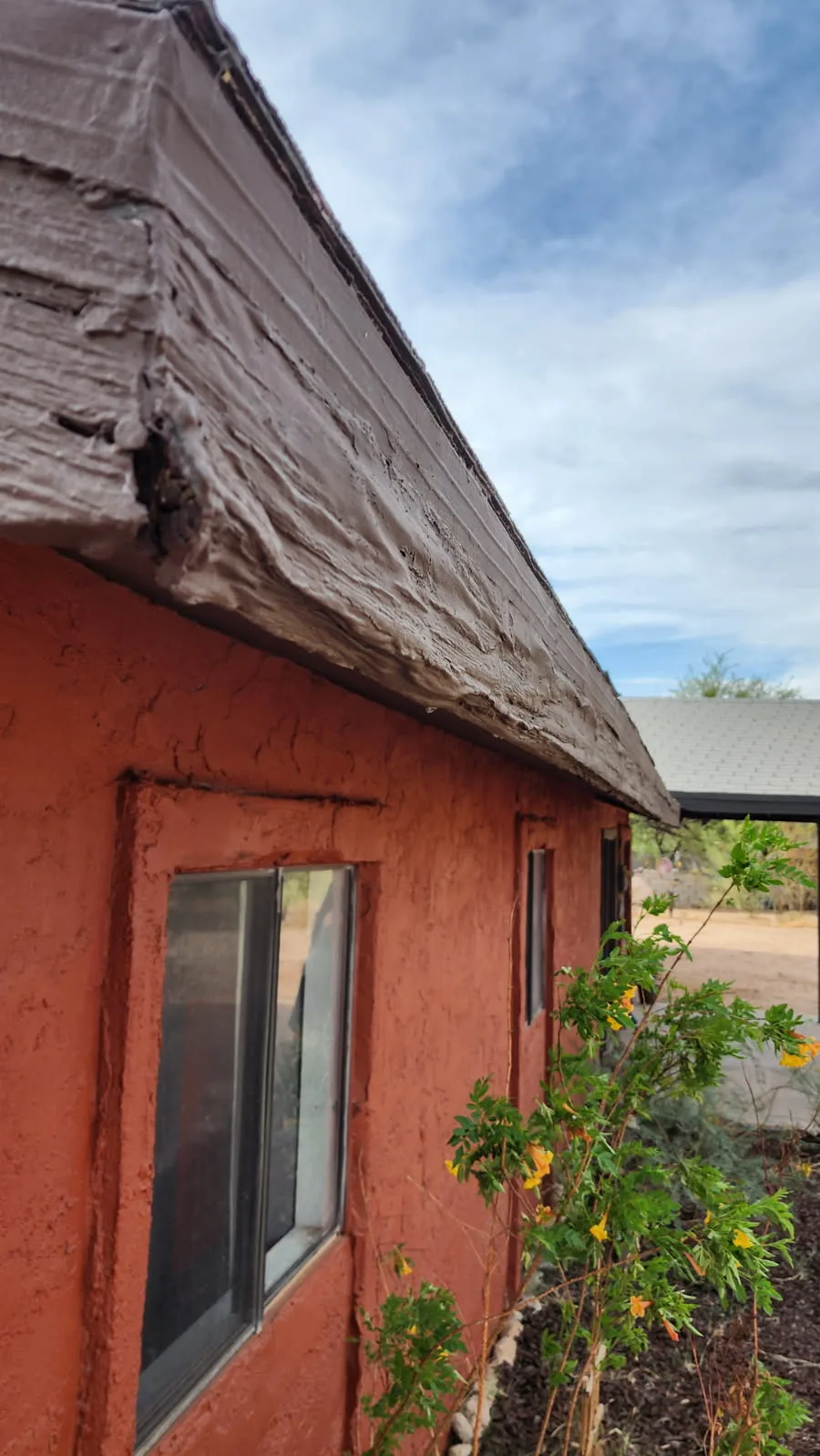 Fascia corner with weathering and wood rot on a Tucson home
