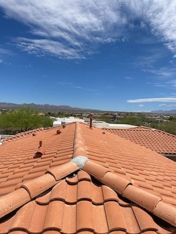 Tile roof valley damage in Arizona showing broken tiles
